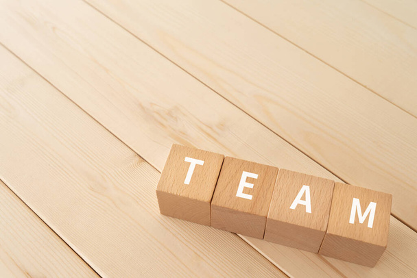 Wooden blocks with "TEAM" text of concept. - 写真・画像