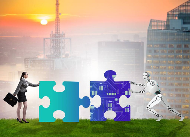 The robot and human cooperating in jigsaw puzzle - Photo, Image