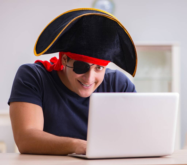The digital security concept with pirate at computer - Photo, Image