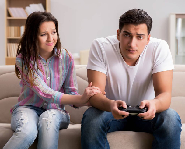 The young family suffering from computer games addiction - Photo, Image