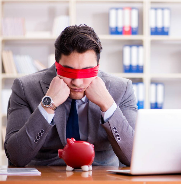 The blindfold businessman sitting at desk in office - Photo, Image