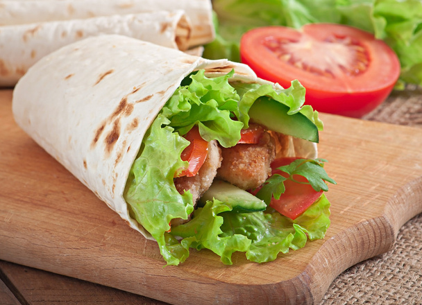 Fresh tortilla wraps with chicken nuggets and vegetables - Photo, Image