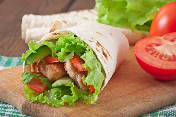 Fresh tortilla wraps with chicken nuggets and vegetables - Photo, Image
