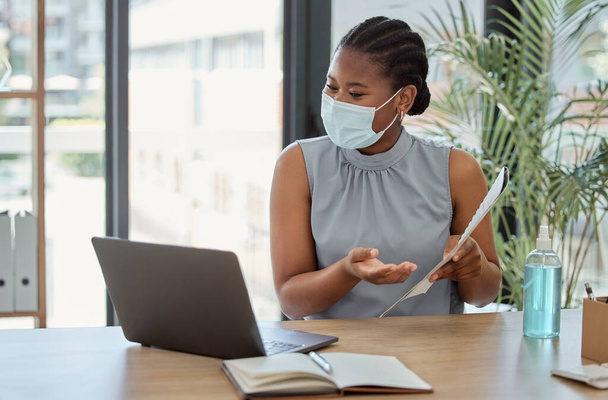 Covid, laptop and black woman on a video call marketing a business proposal or startup paperwork feedback. Agenda, coronavirus and African employee in mask speaking, communication or talking online. - Photo, Image