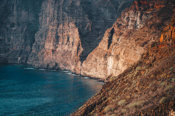 Los Gigantes cliffs, mountain ranges and deep ocean view at sunset. Tenerife. Santiago del Teide. Canary Islands, Spain. Close up. Detailed high quality image - Fotó, kép