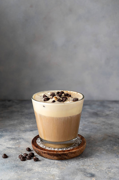 Coffee and vanilla ice crem with chocolate , coffee beans in glass cup, copy space. Lisestyle iced coffee drink - 写真・画像