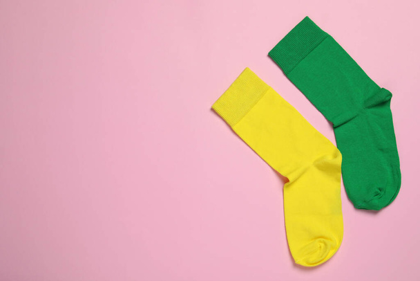 Different socks on pink background, flat lay. Space for text - Fotografie, Obrázek