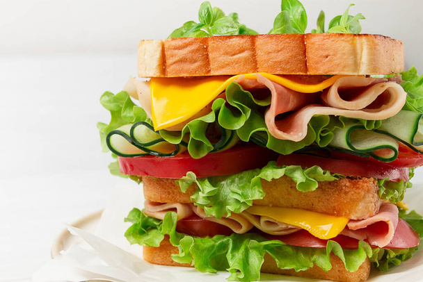 Club sandwich, on a white table, close-up, no people, horizontal, homemade, - Foto, afbeelding