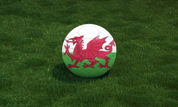 Футбольный мяч с флагом Уэльса цвета на стадионе на зеленом фоне травы. 3D иллюстрация. - Фото, изображение