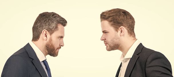 Man face portrait, banner with copy space. two businessmen starring to each other in business conflict, opposition - 写真・画像