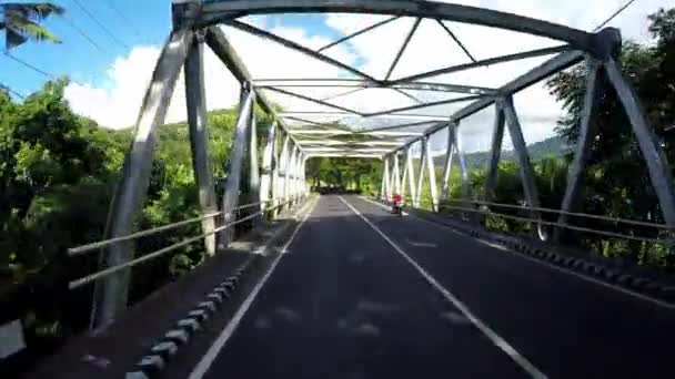 Indonesia, Bali saari tieliikenne, POV moottoripyörästä - Materiaali, video