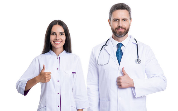 cardiologist doctor and nurse show thumb up. photo of cardiologist doctor and nurse wear white coat. doctor cardiologist and nurse with stethoscope. cardiologist doctor and nurse isolated on white. - 写真・画像