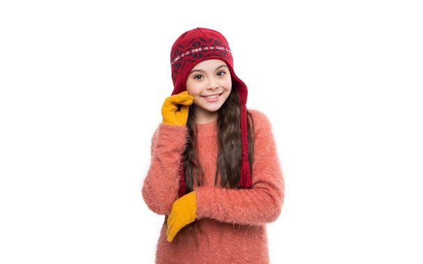 teen girl model smile in warm hat. teen girl in warm hat isolated on white background. teen girl wear sweater and warm hat in studio. winter fashion for teen girl. warm hat knitwear. - Photo, image