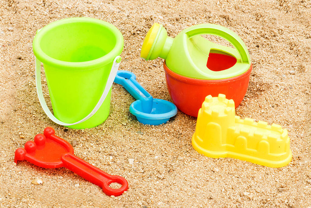 colorful plastic toys for the beach on sand - Fotoğraf, Görsel