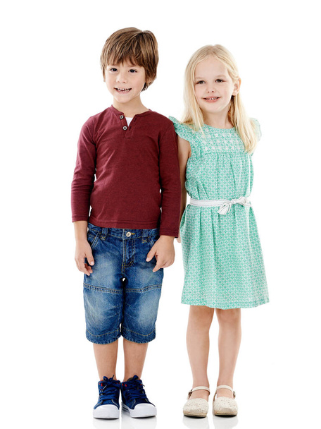 Two peas in a pod. Studio shot of a cute little boy and girl posing together against a white background - Foto, immagini