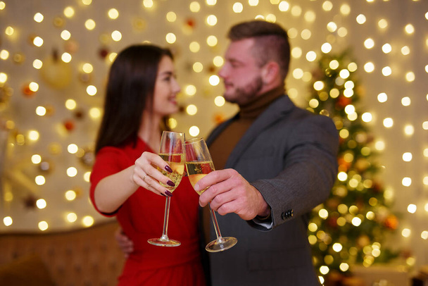 Close up of woman and male hands with champagne glass - Foto, Imagen