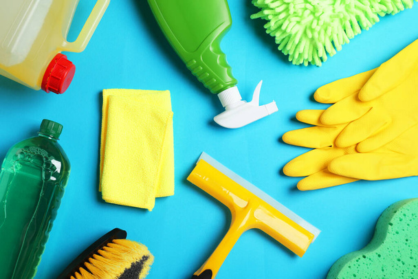 Flat lay composition with different car wash products on light blue background - Foto, Imagen