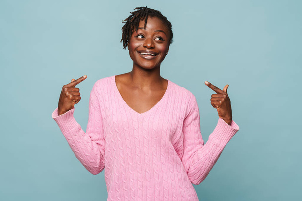African american happy woman smiling and pointing at herself isolated over blue background - Fotó, kép