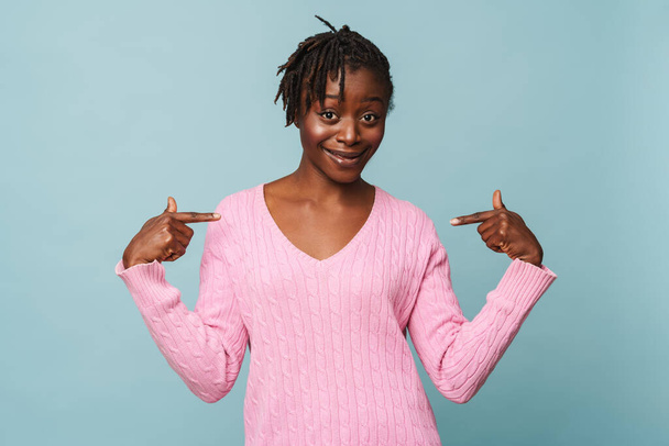 African american happy woman smiling and pointing at herself isolated over blue background - Photo, Image