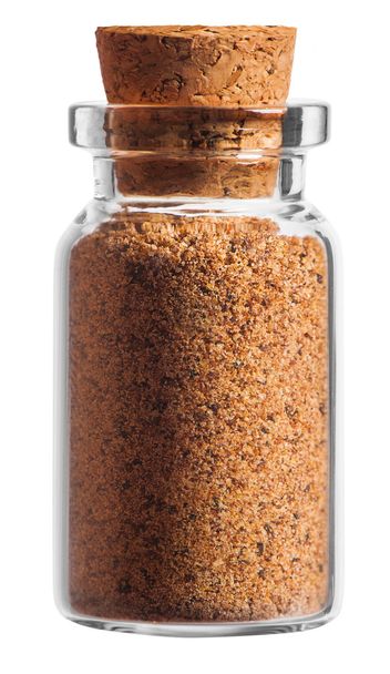 almond spice in a little bottle isolated on white background - Foto, Imagem