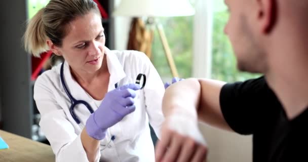 Dermatologist examines patient skin on elbows. Skin examination by doctor health problems allergies - Footage, Video