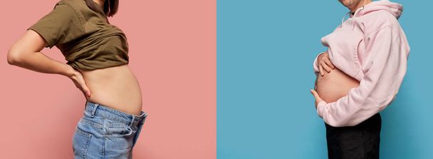 Pregnancy or overweight. Cropped image of male and female body over pink and blue background. Models show their bellies each other. Concept of healthy eating, fitness, sport, active lifestyle. - Fotoğraf, Görsel