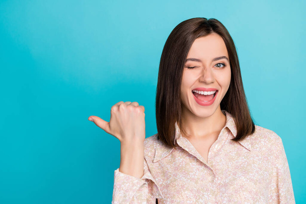 Close up photo of positive lady wear stylish blouse wink eye thumb arm direct empty space cool discount isolated on cyan color background. - Φωτογραφία, εικόνα