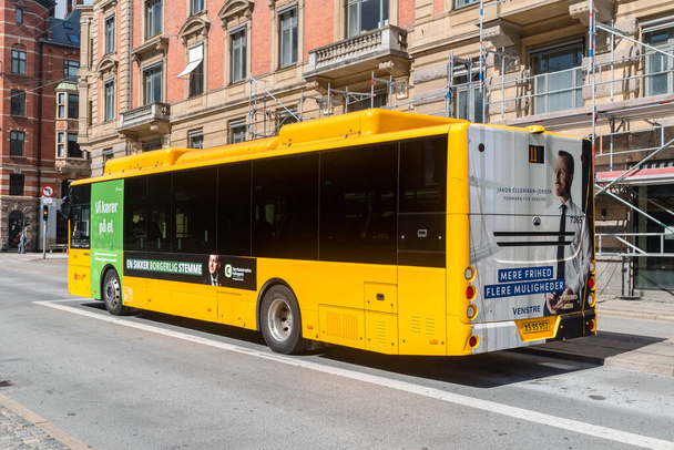 Copenhagen, Denmark - July 26, 2022: Yellow city bus in Copenhagen. Bus of public transport. - Photo, image