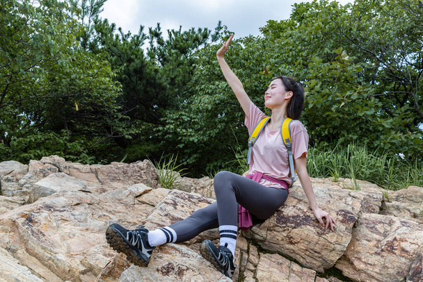 korean young woman hiker on the rock - Fotó, kép