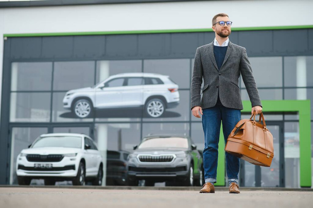 Portrait of happy customer buying new car - Фото, изображение