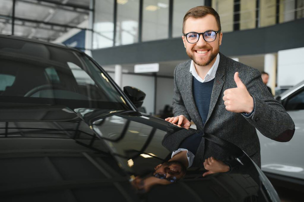 Portrait of happy customer buying new car - Foto, Imagen