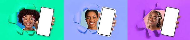 Τρεις χαμογελαστές κομψές όμορφες νεαρές μαύρες κυρίες που δείχνουν σύγχρονα smartphones με λευκές λευκές λευκές οθόνες mockup μέσα από τις τρύπες φακούς σε πολύχρωμους τοίχους από χαρτί, συνιστώντας ωραία προσφορά, κολάζ, banner - Φωτογραφία, εικόνα