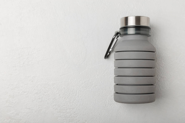 Stylish thermo bottle on a textured background. Thermos. Bottle for water. place for text. copy space. - Foto, immagini