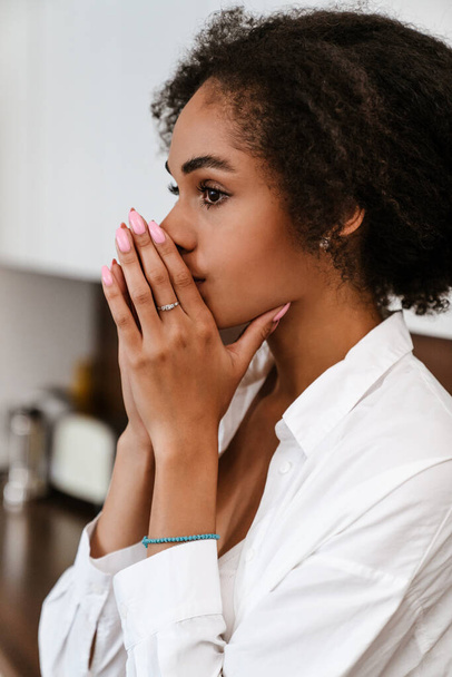 Young black woman being upset and thinking about abortion at home - Photo, Image