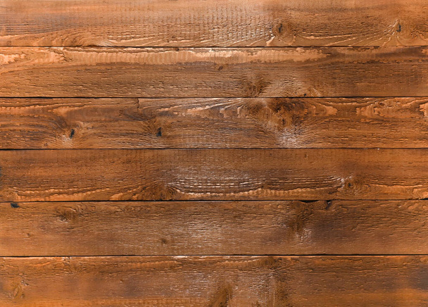Wooden panel made of boards with a beautiful pattern, parquet texture. - Фото, изображение