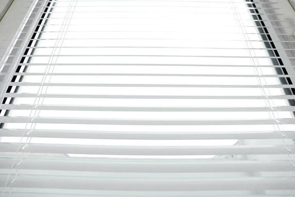 Stylish horizontal window blinds, low angle view - Foto, Bild