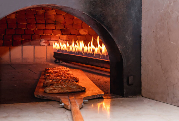pita bread in oven, close up - Photo, image