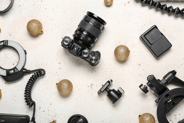 Photographer's equipment with Christmas balls on white background - Photo, Image
