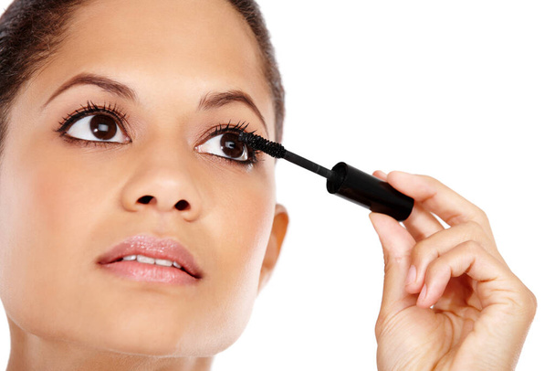 Instant glamourous lashes. Attractive young woman applying mascara to her eyelashes - Photo, Image