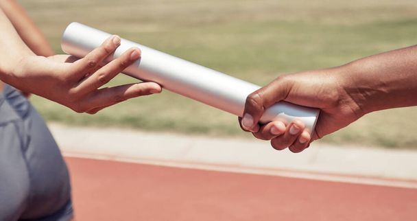 Hands, team and sports relay baton for running, sprint or fitness marathon for olympic athletics on stadium track. Hand of runner holding bar in teamwork sport for run, race or competition of speed. - Фото, зображення