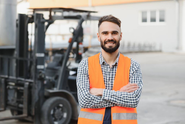 young worker in warehouse background. - Foto, Bild