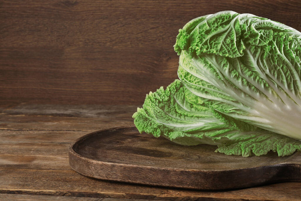 Fresh ripe Chinese cabbage on wooden table. Space for text - Фото, зображення