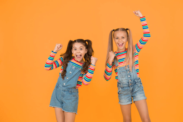 got great style. small sisters have fun. little girls yellow background. hairdresser salon. kid summer fashion. beauty and style. childhood happiness. happy school friendship. best friends forever. - Foto, Bild