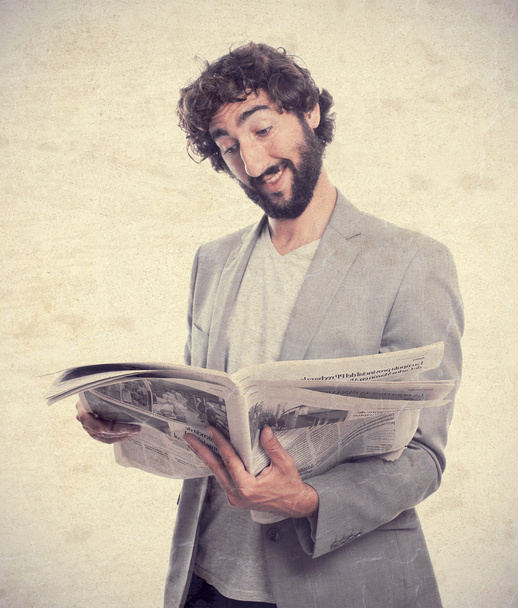 Young crazy man with newspaper - Фото, изображение