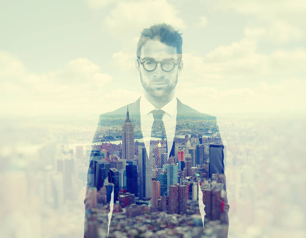 Metro man. Composite image of a well-dressed man superimposed on an image of a city - Photo, Image