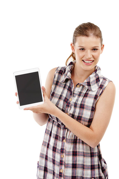 Everyone at school has one of these. An attractive teenage girl holding a digital tablet - Zdjęcie, obraz
