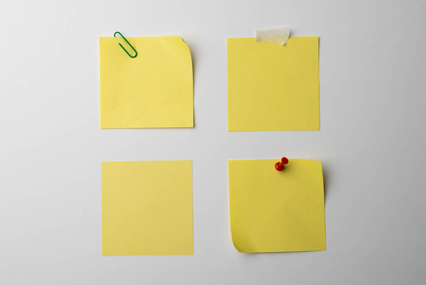 Yellow sticky memo notes with copy space on white background. Abstract paper texture background and communication concept. - Fotografie, Obrázek