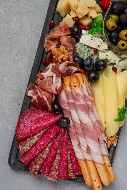 Appetizer, assortment, set, sausage, and cheese, on a wooden board, top view, no people, - Foto, imagen