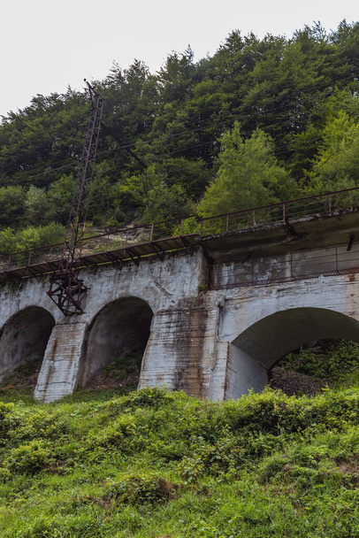 Old railway bridge in the mountains. Ukrainian Carpathians. Carpathians view - Photo, Image