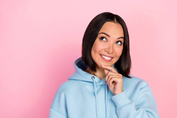 Photo of cheerful cute pretty lady wear stylish sweatshirt interested look empty space cool proposition isolated on pink color background. - Foto, imagen